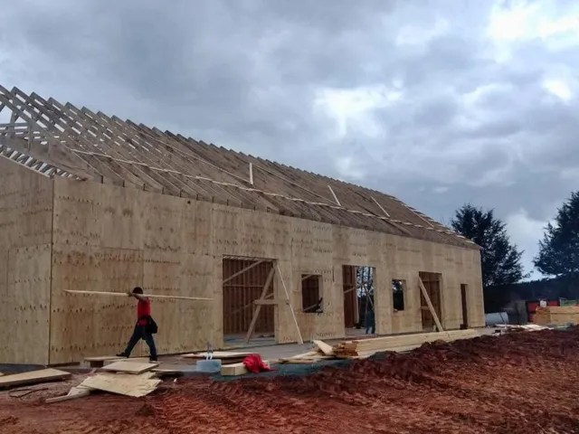 Modern Style Barn Construction Progress — photograph 4